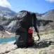 XP Backpack 240 - backpack beside a lake in a mountain landscape
